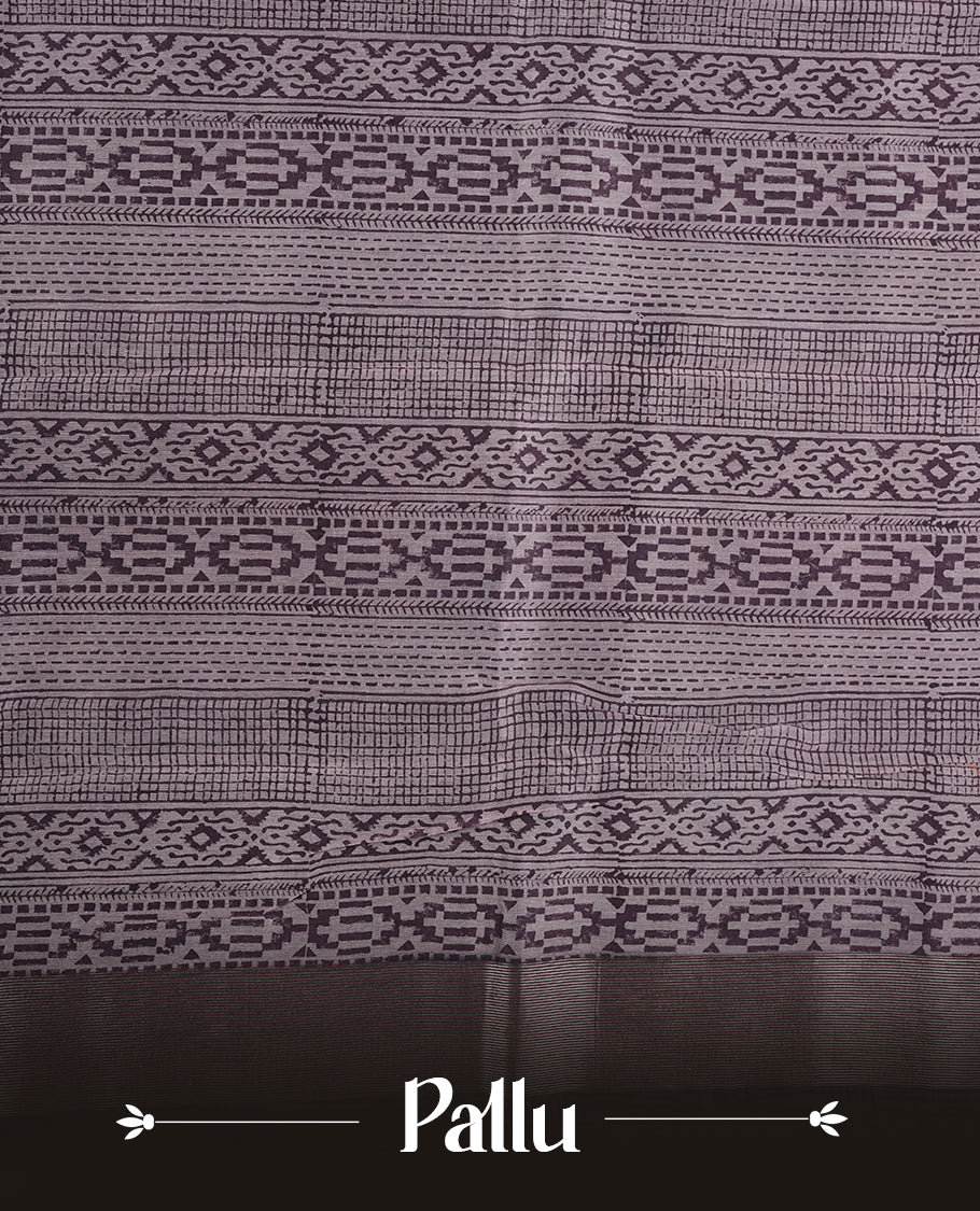 Purple colour chanderi silk saree featuring geometric print pattern across body, with contrast Blue colour border with zari pattern and paired with matching blouse.