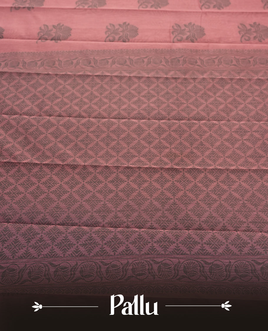 Mauve colour silk cotton saree featuring elegant floral zari motifs on the body, complemented by a rich contrast dark border and pallu with traditional woven detailing & Comes with a matching blouse piece.