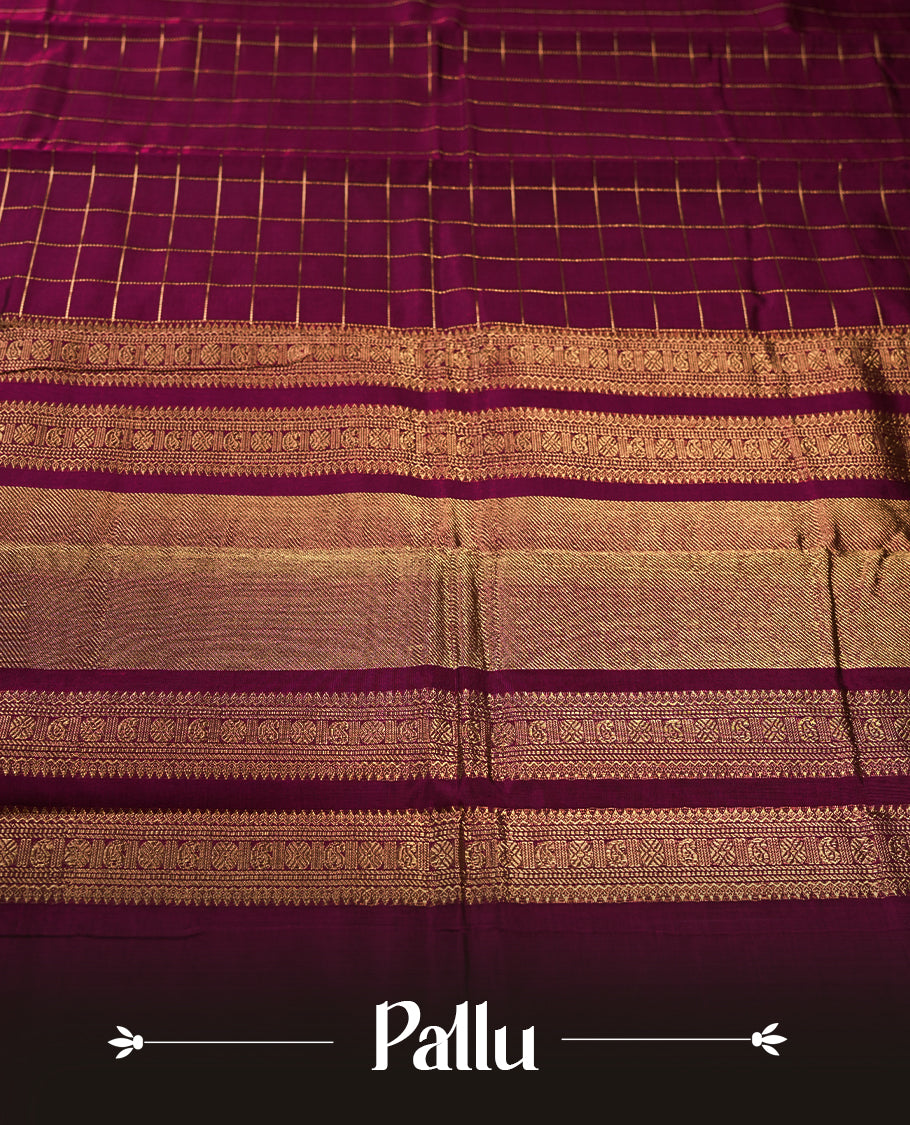 Deep Magenta colour pure Kanchi cotton saree featuring with delicate golden checks on body, paired with a contrasting deep maroon zari woven border & Includes a matching blouse piece for a complete look.