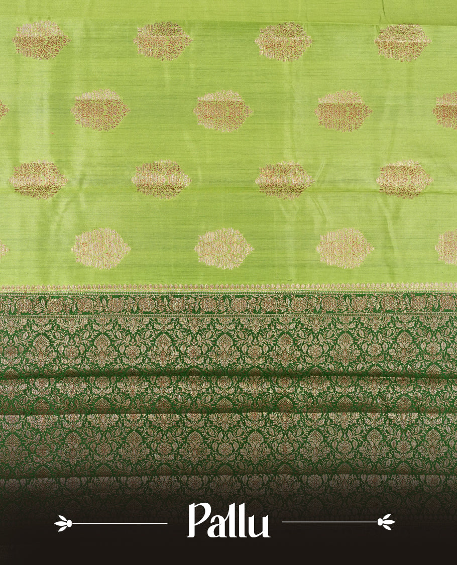 Green Colour Banaras Soft Silk Saree with Gold Zari Round Cluster Buttas, Intricate Multi-Layered Floral Border, Grand Pallu with Ornate Brocade Motifs in Deep Green and Gold Tones, and Matching Blouse.