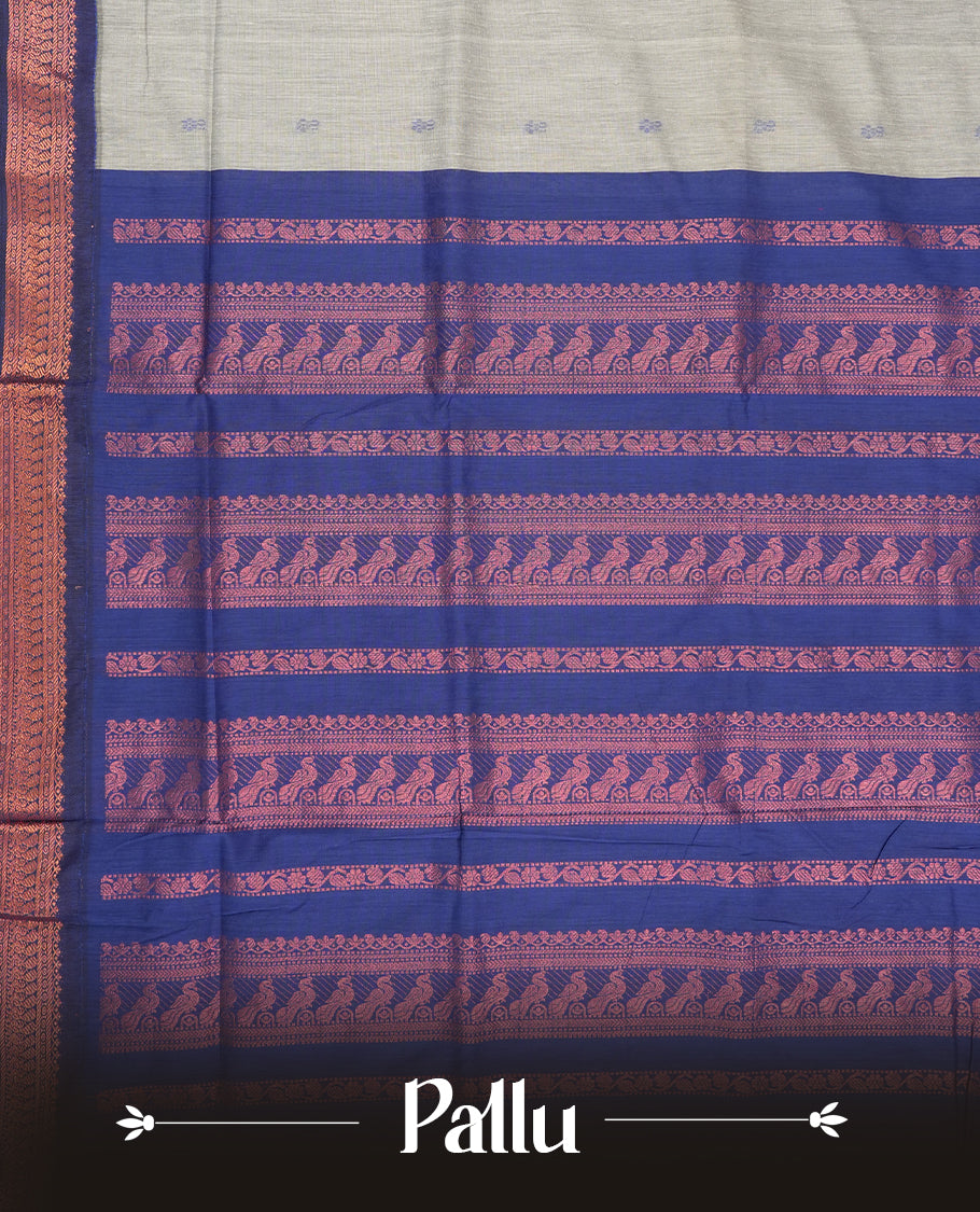 Grey colour Kalyani Cotton saree with delicate woven zari royal blue motifs all over, paired with a contrasting royal blue border and pallu intricately woven with rich copper zari & Comes with a matching blouse piece.
