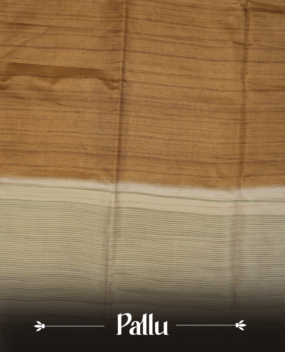 Khaki colour semi tusser silk saree featuring contrast cream colour London bridge printed pattern border and paired with matching blouse.