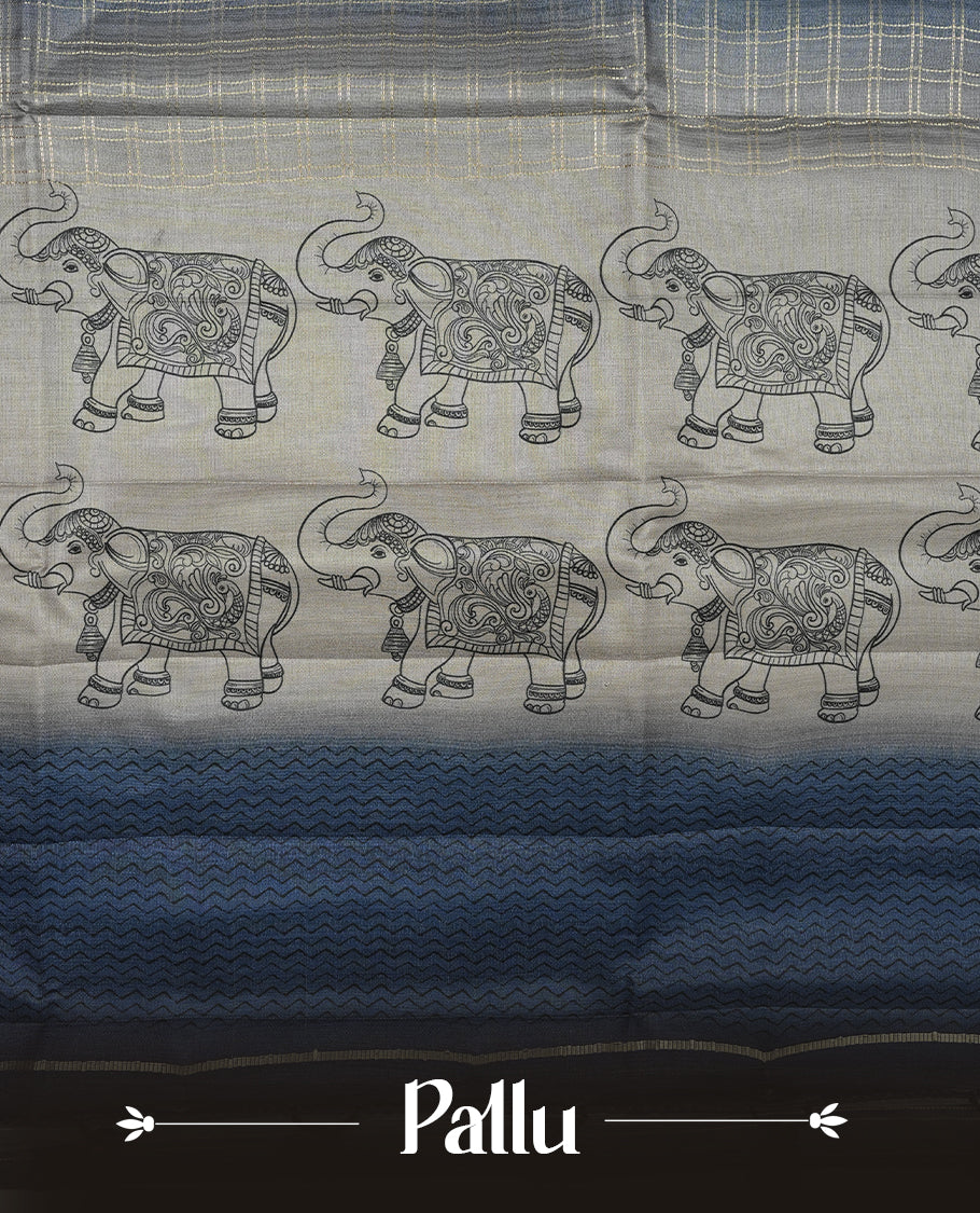 Ash blue colour semi tusser silk saree featuring Gold zari check pattern across body, faded contrast cream colour border with elephant print and paired with matching blouse.