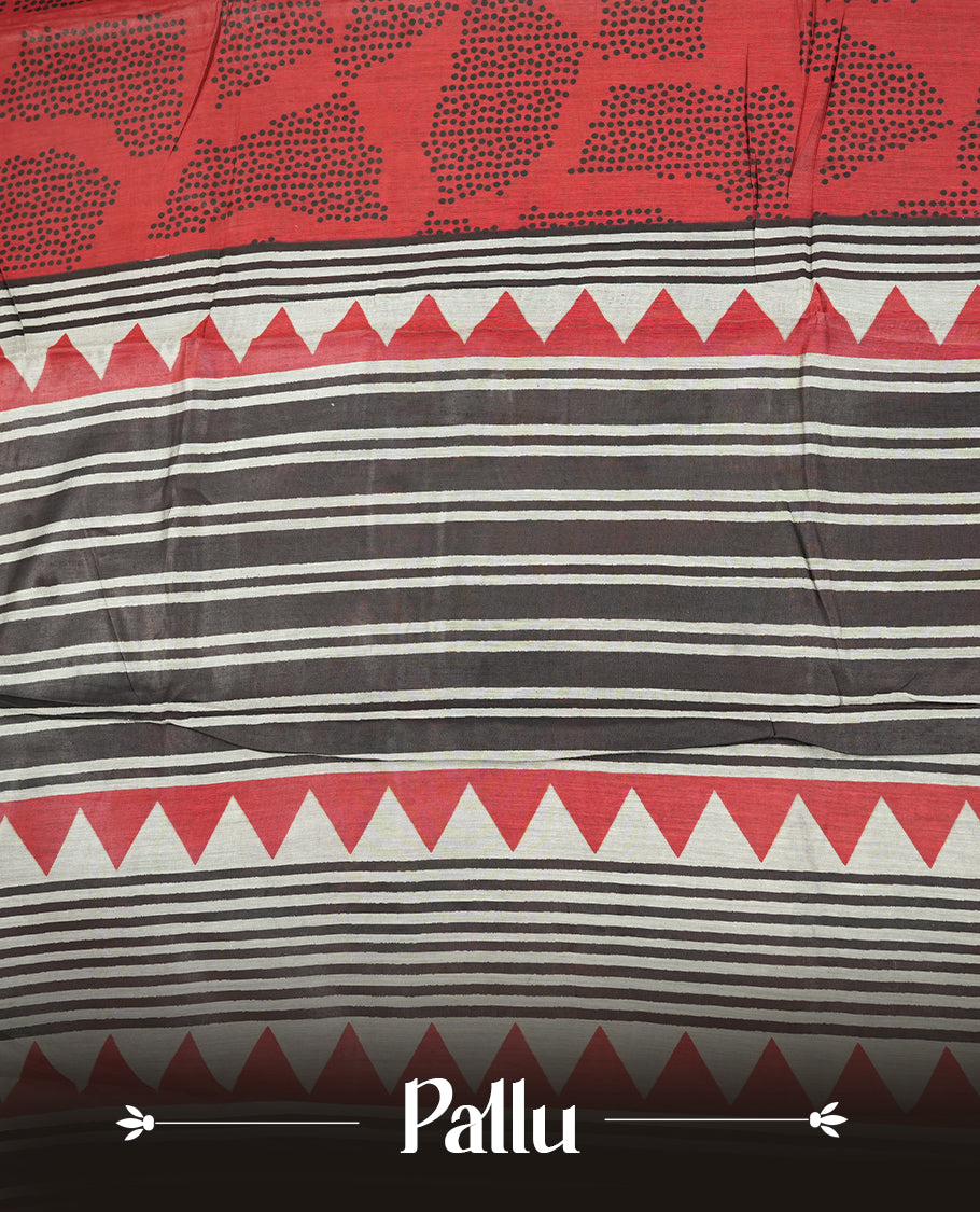 Coral red colour mixed chanderi cotton saree featuring black dot printed body, striped pallu with black and red geometric patterns, golden zari border, and matching blouse