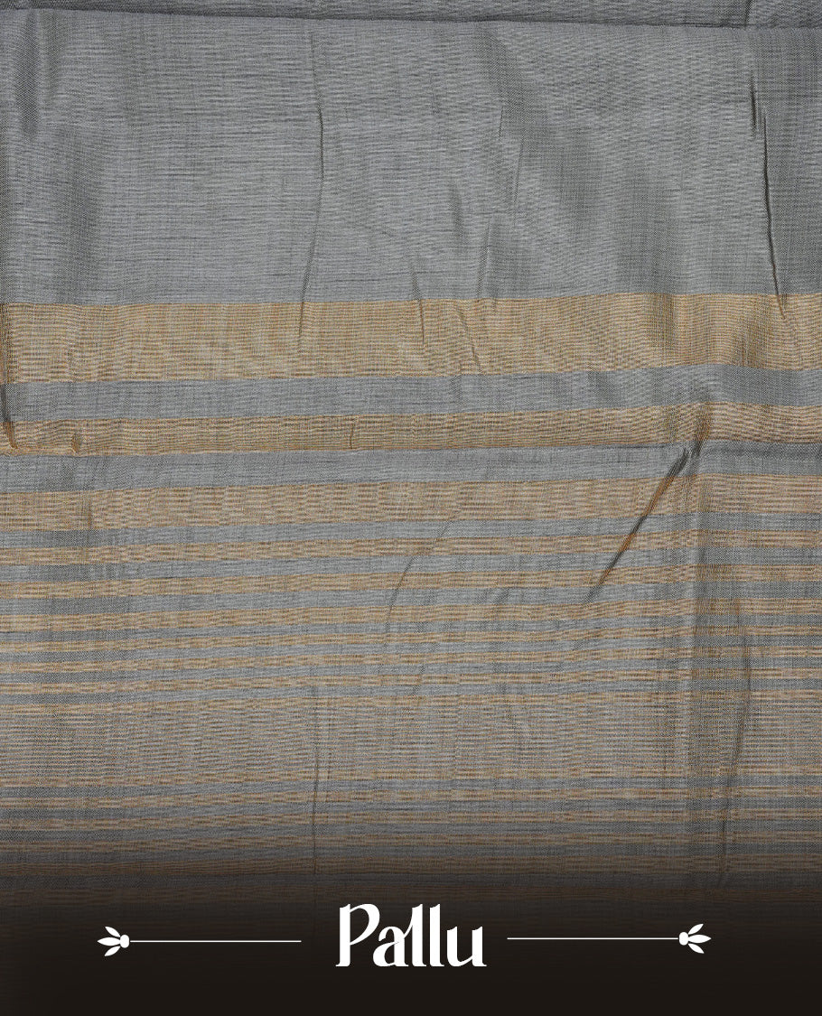 Gray colour semi tussar silk saree featuring an elegant plain body with traditional gold zari detailed border for a refined look. Comes paired with a matching blouse piece.