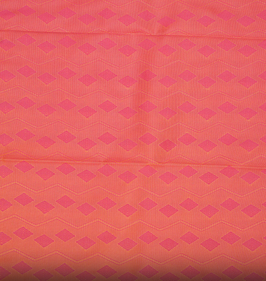 Pale yellow colour Semi silk saree featuirng Cream colour patterns on body, complemented by contrast magenta colour with gold zari border, paired with matching blouse piece.