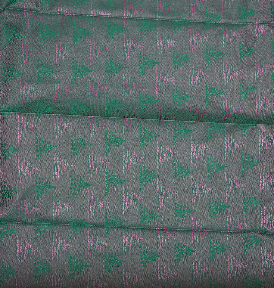 Baby pink colour Semi silk saree Featuring self colour zari motifs on body, complemented by contrast green colour with gold zari border, paired with matching blouse piece.
