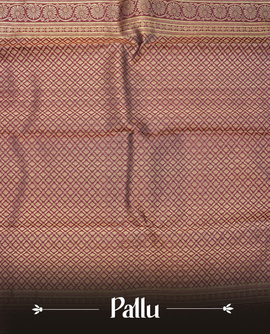 Chocolate Colour Pure Wedding silk saree featuring Gold zari Floral kodi pattern worked body, complemented by self colour with traditional border, comes with matching blouse piece.