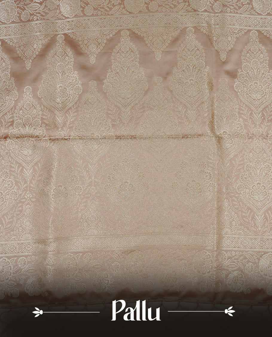 Muted Beige gold colour Mulberry silk saree featuring light gold small buttas & big motifs onbody, complemented by self colour with Light gold zari floral Border, comes with matching blouse piece.