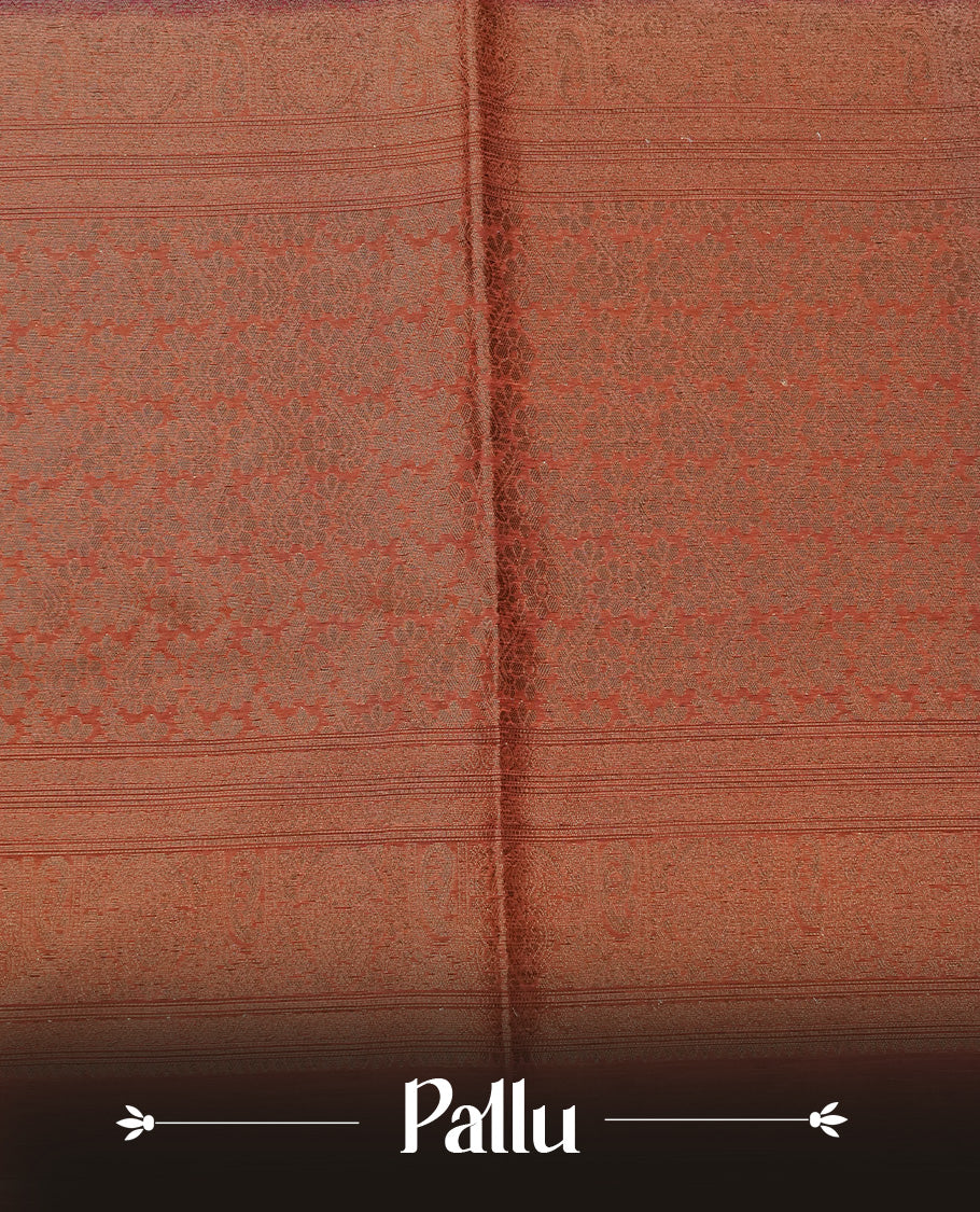 Wine colour semi silk saree featuring Gold zari Leaf pattern on body, complemented by contrast Rust Orange colour with Gold zari border, comes with matching blouse piece.