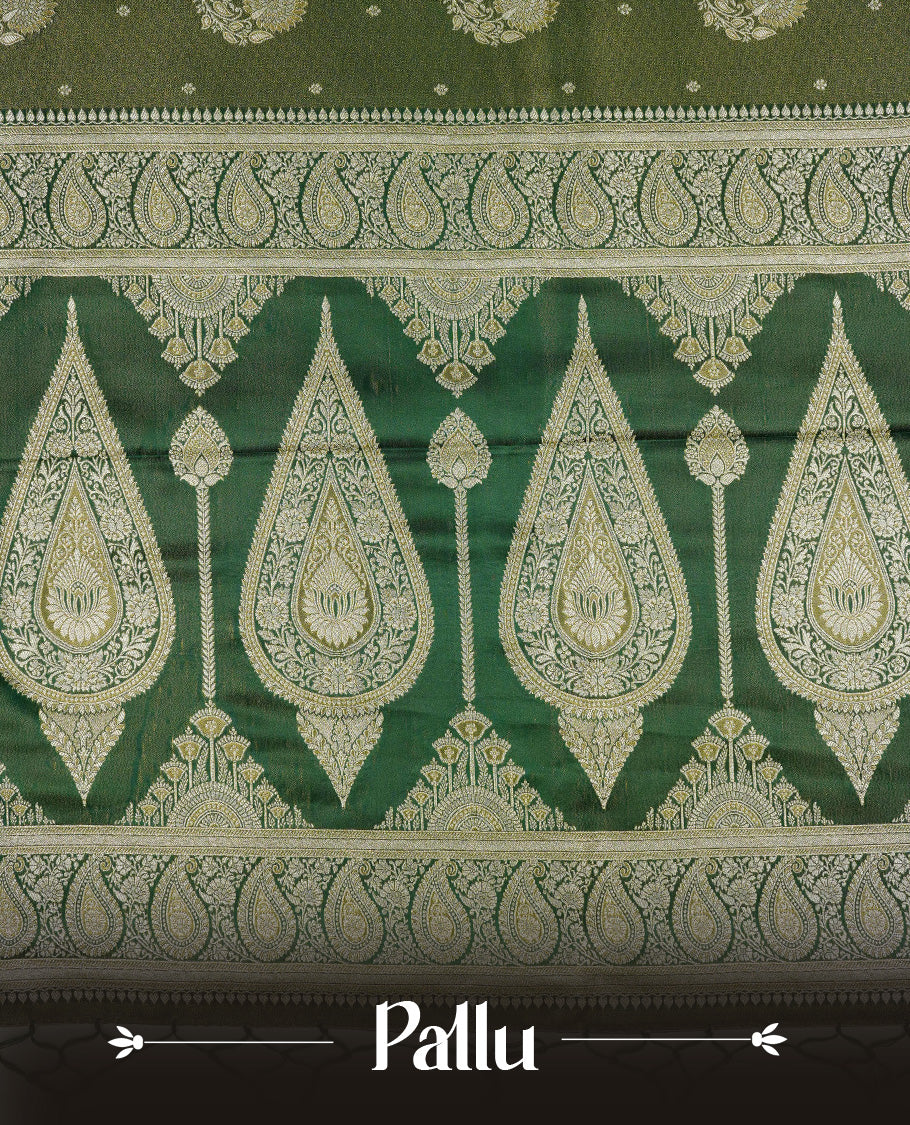 Green colour Mulberry silk saree featuring Gold zari small buttas & floral motifs on body, complemented by self colour with Gold zari border, comes with matching blouse piece.