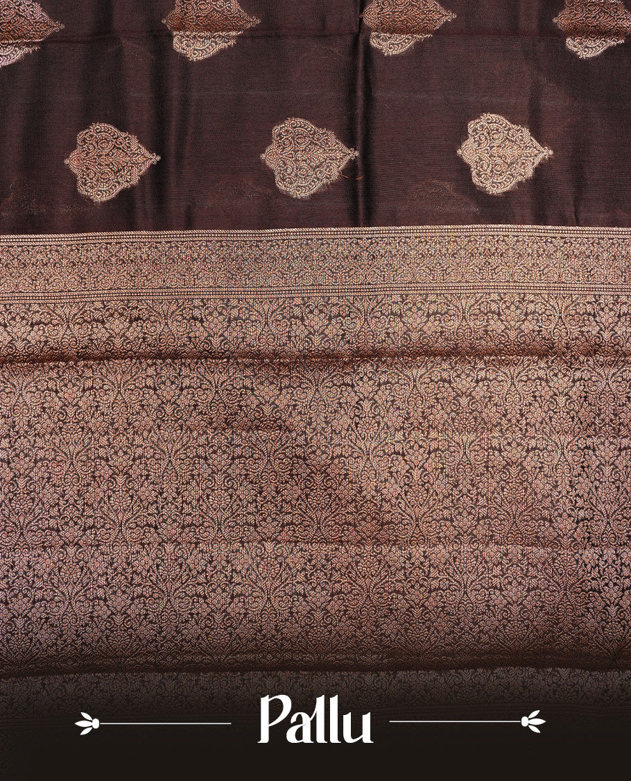 Chocolate Brown Colour Pure Banaras Soft Silk saree featuring Antique Zari buttas in body, complemented by zari work on self colour border, paired with matching Blouse Piece.