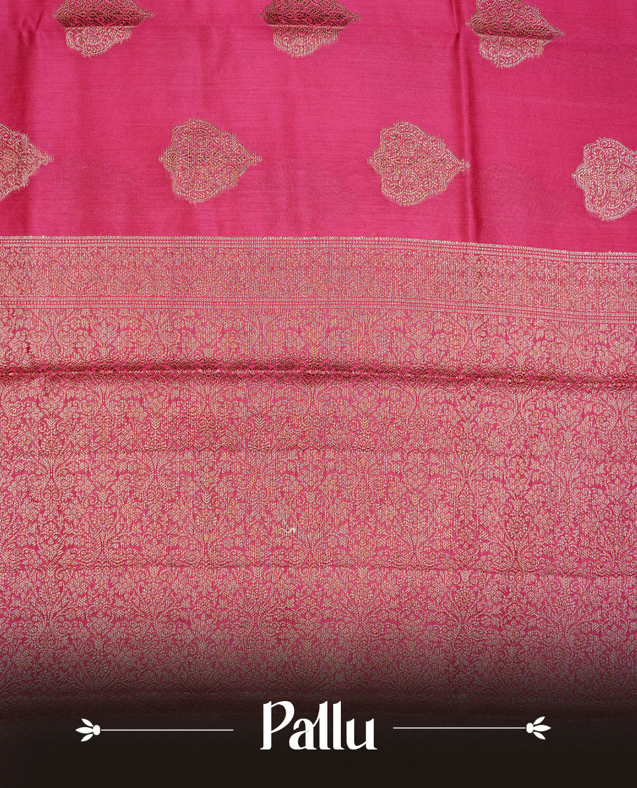 Magenta Colour Pure Banaras Soft Silk saree featuring Antique Zari buttas in body, complemented by zari work on self colour border, paired with matching Blouse Piece.
