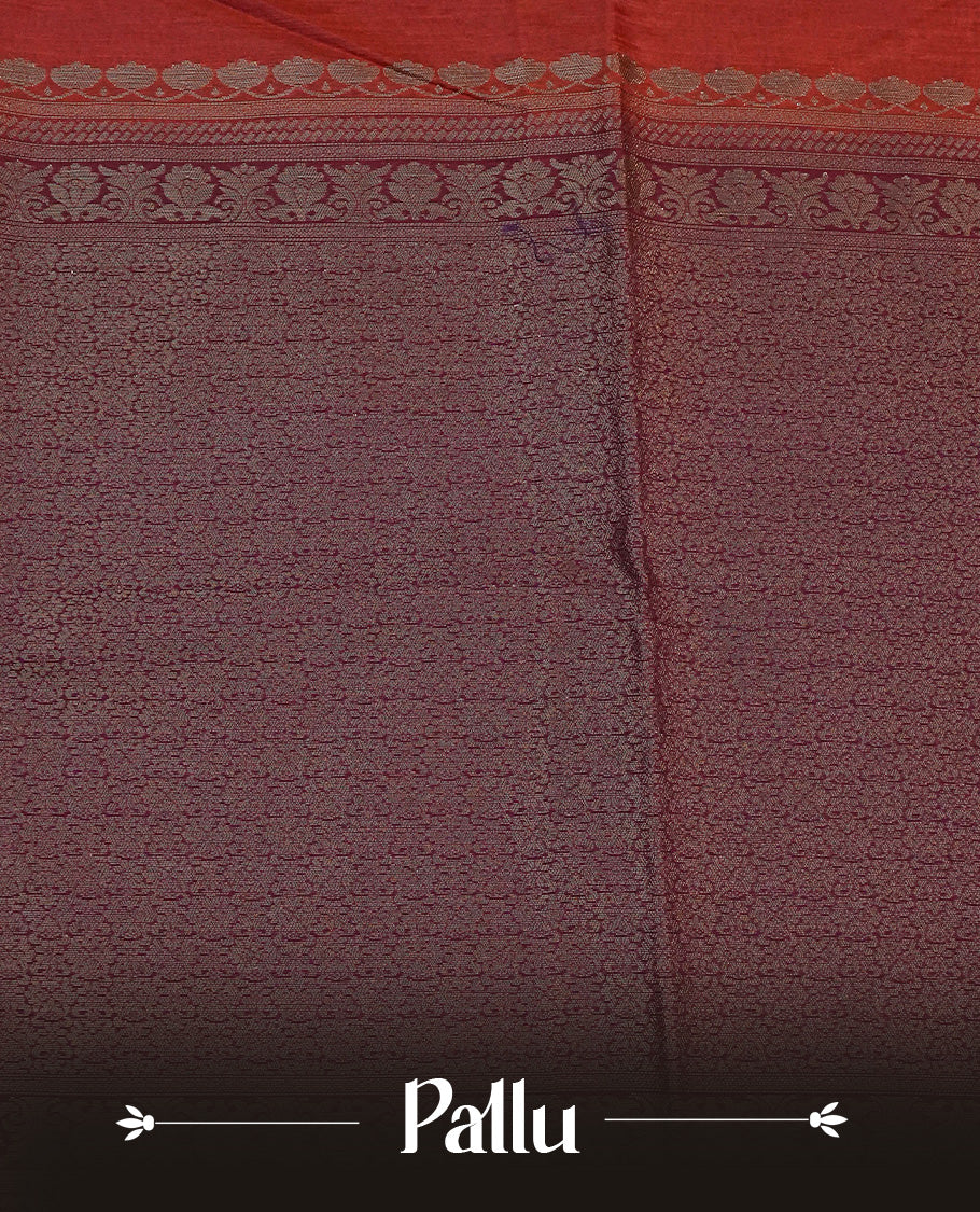 Brick red colour semi linen saree with elegant gold zari floral motifs across the body, complemented by a contrast colour with grand gold zari pallu and a borderless design, paired with a matching blouse piece.