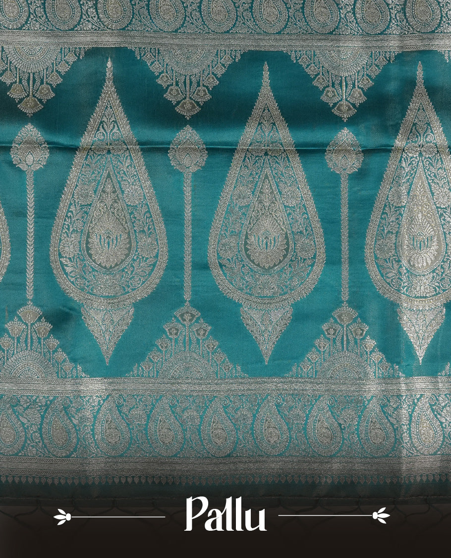 Teal colour Mulberry silk saree featuring Gold zari small buttas & floral motifs on body, complemented by self colour with Gold zari border, comes with matching blouse piece.