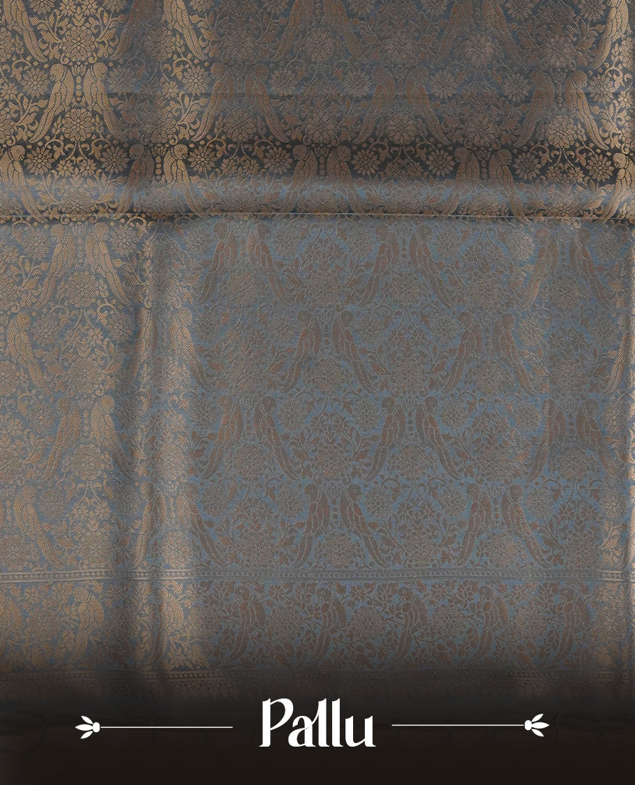 Pastel teal colour Mulberry silk saree featuring Gold zari bird motifs on body, complemented by self colour with gold zari border, comes with matching blouse piece.