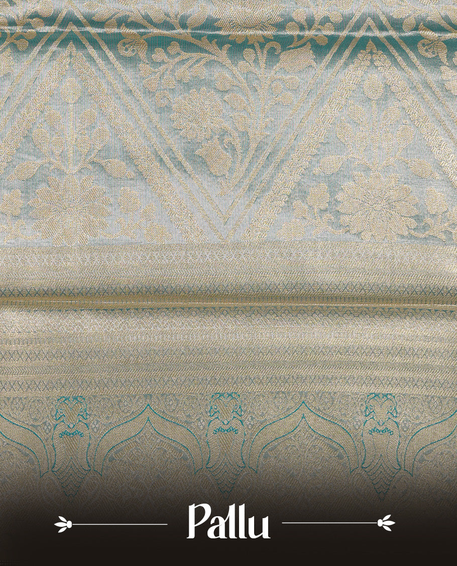 Light Pink colour Tissue silk saree featuring Gold zari Floral kodi design on body, enhance with Aqua colour with traditional zari border, paired with matching blouse piece.