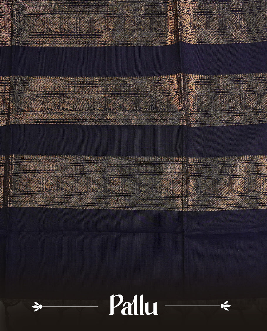 Navy Blue colour chettinad cotton saree featuring Gold Motifs on body, complemented by Contrast Green & Pink Colour With Gold Zari border, paired with matching blouse piece.