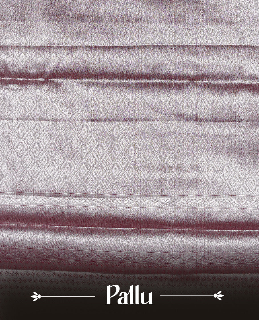 Silver & Maroon colour Tissue silk saree featuring Maroon & Silver zari kodi pattern on body, enhanced with Zari border on self colour, paired with matching Blouse piece.