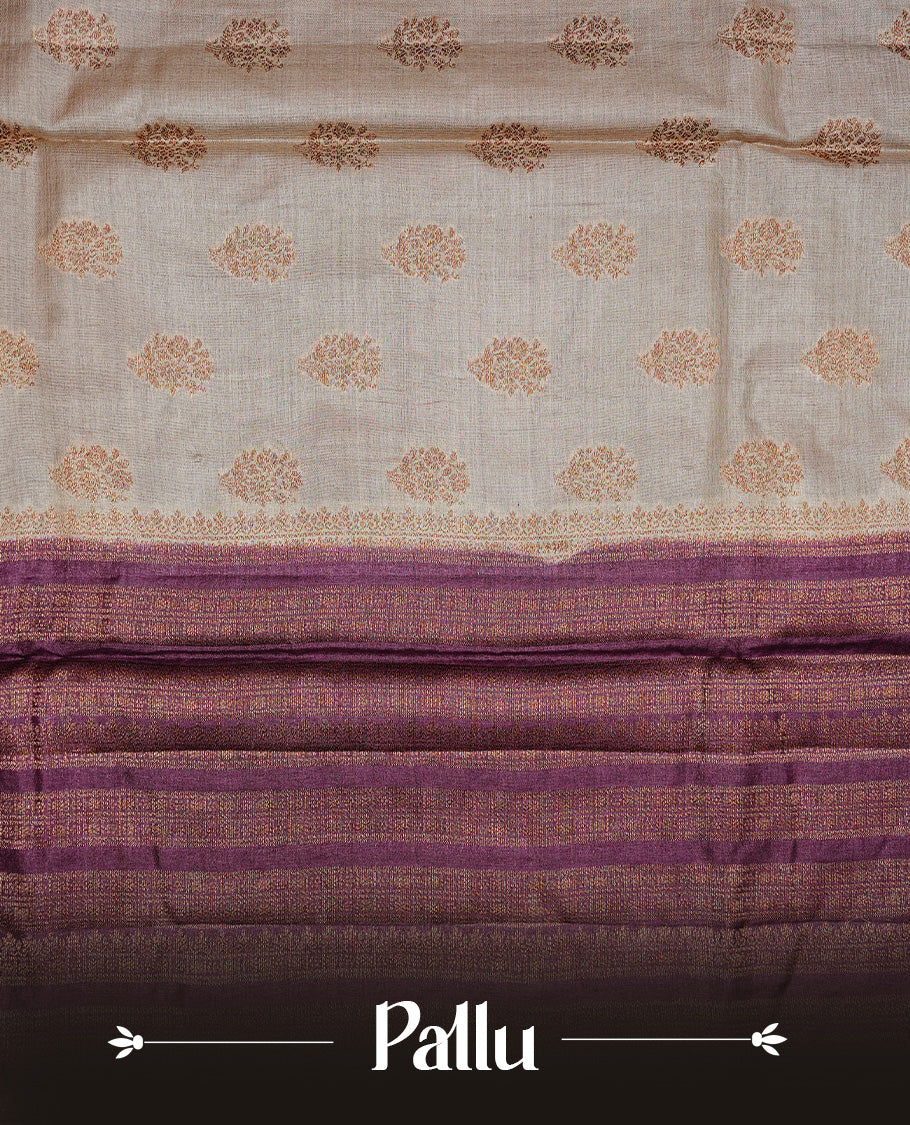 Golden Cream Colour Banaras tussar silk saree featuring Antique zari Motifs on body, Complemented by Burgundy colour variant with zari border, paired with matching blouse Piece.