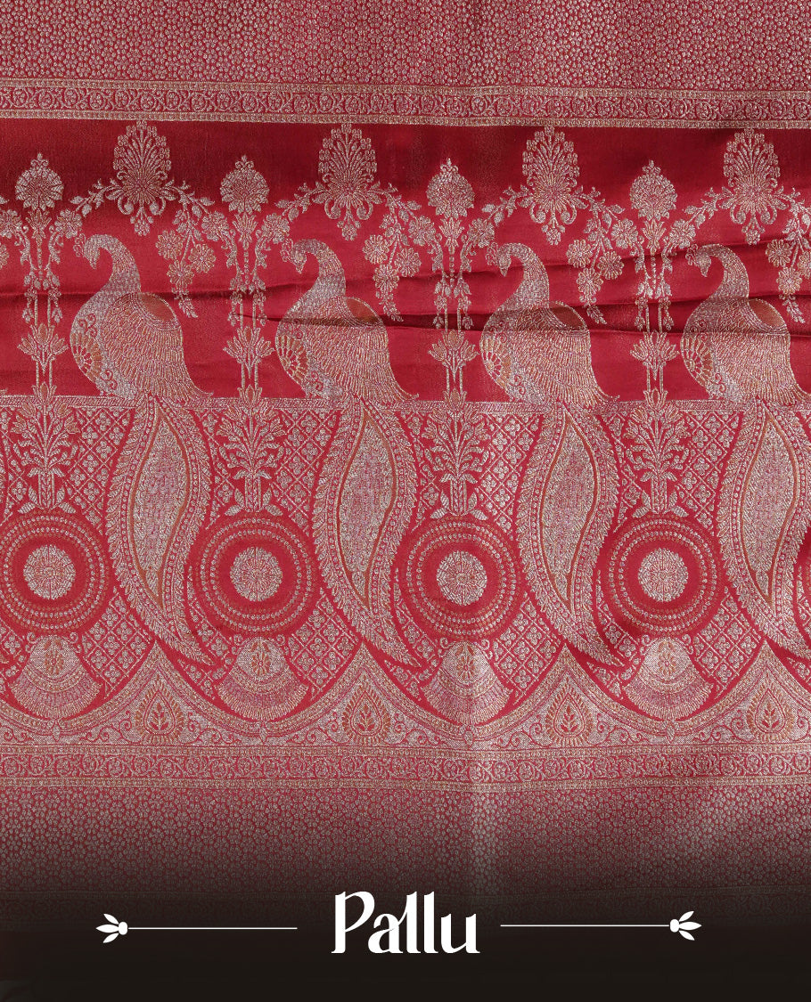 Red colour Mulberry silk saree featuring Gold zari buttas on body, complmented by self colour with Gold zari dual peacock in Temple design border, comes with matching blouse piece.