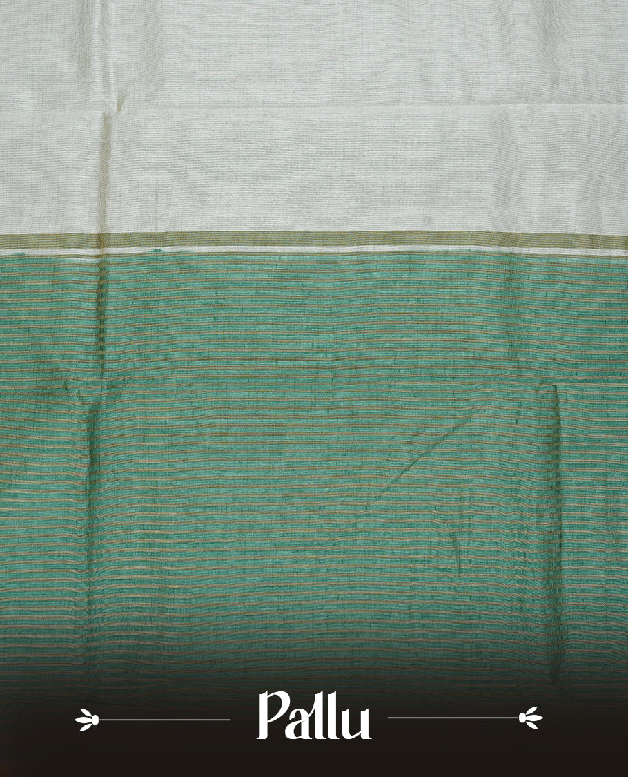 White cream colour Semi Tussar silk saree featuring an elegant plain body, accentuated by a contrast Aqua green border adorned with intricate gold zigzag zari work, paired with a matching blouse piece.