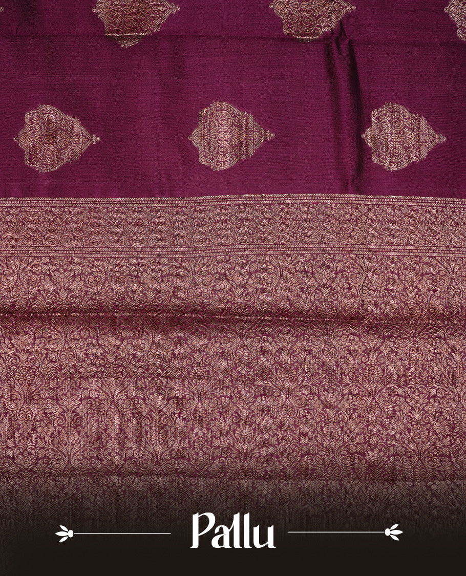 Burgundy Colour Pure Banaras Soft Silk saree featuring Antique Zari buttas in body, complemented by zari work on self colour border, paired with matching Blouse Piece.
