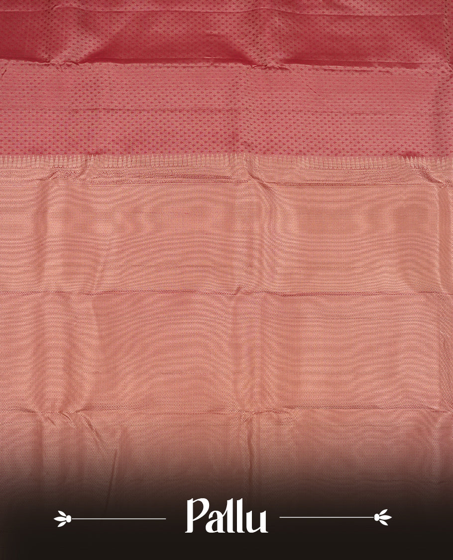 Dark mauve colour Vasundhara silk saree adorned with all-over tiny motifs on the body, complemented by a self colour with tiny diamond pattern with gold tree motifs on border and paired with a matching blouse piece.