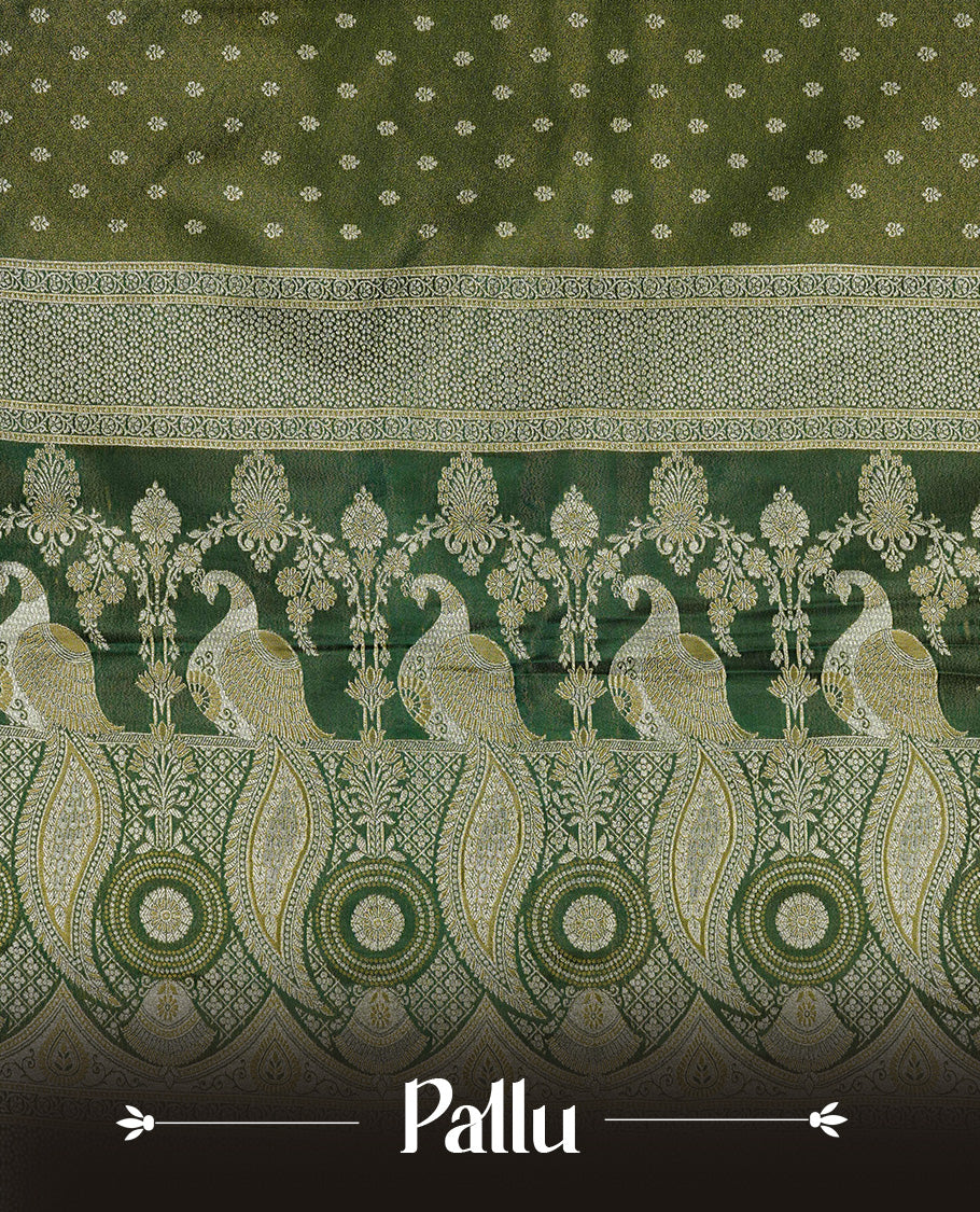 Green colour Mulberry silk saree featuring Gold zari buttas on body, complmented by self colour with Gold zari dual peacock in Temple design border, comes with matching blouse piece.