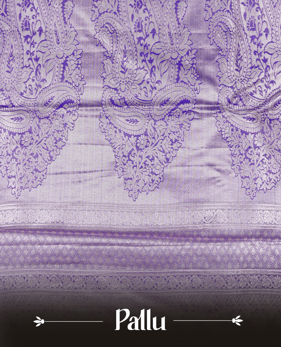 Light purple colour tissue saree featuring rose gold zari floral kodi pattern on the body, highlighted by a self colour border with rose gold traditional zari, paired with a matching blouse piece.