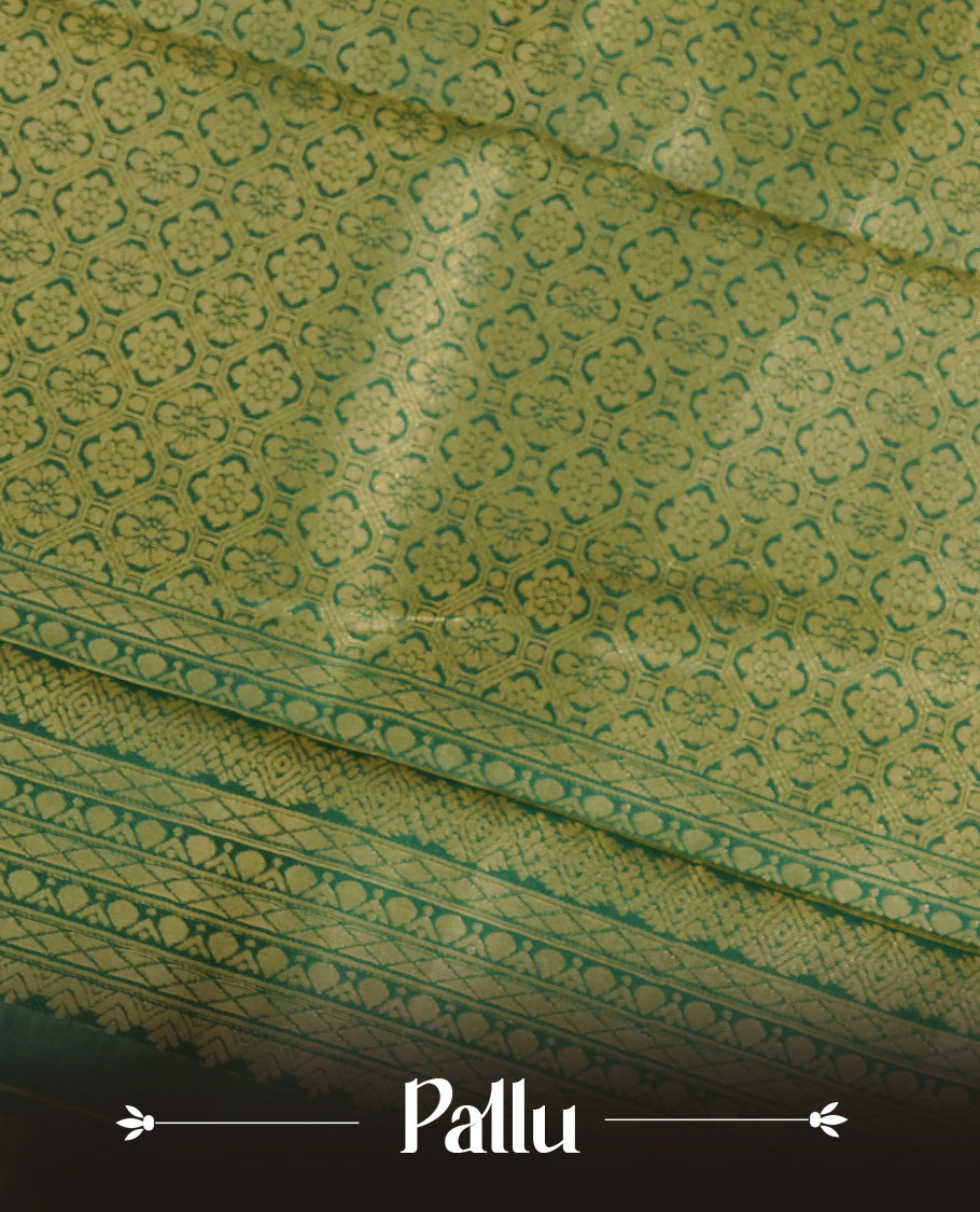 Cream Colour Semi Soft Silk Saree Featuring Gold zari Check With motifs Pattern On Body, Highlighted by contrast Green border with Gold zari, paired with matching blouse piece.