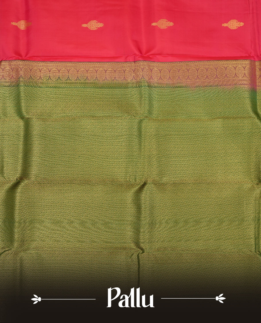 Rani pink colour Vasundhara silk saree adorned with all-over gold motifs on the body, complemented by a contrast green with gold tarditional border and paired with a matching blouse piece.