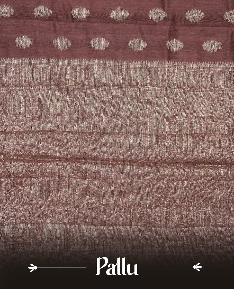 Brown colour Tussar Silk saree featuring elegant antique zari butta motifs on Body , complemented by a self-coloured floral Gold zari border and pallu, paired with a matching blouse piece.