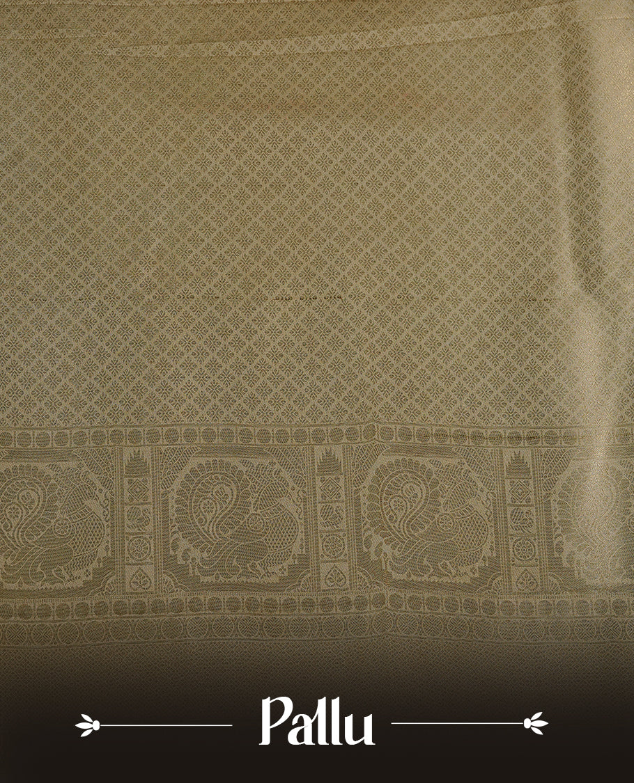 Cream colour soft silk saree featuring gold zari Chakram & peacock motifs inside box pattern on body, complemented by self colour with traditional border, paired with matching blouse piece.