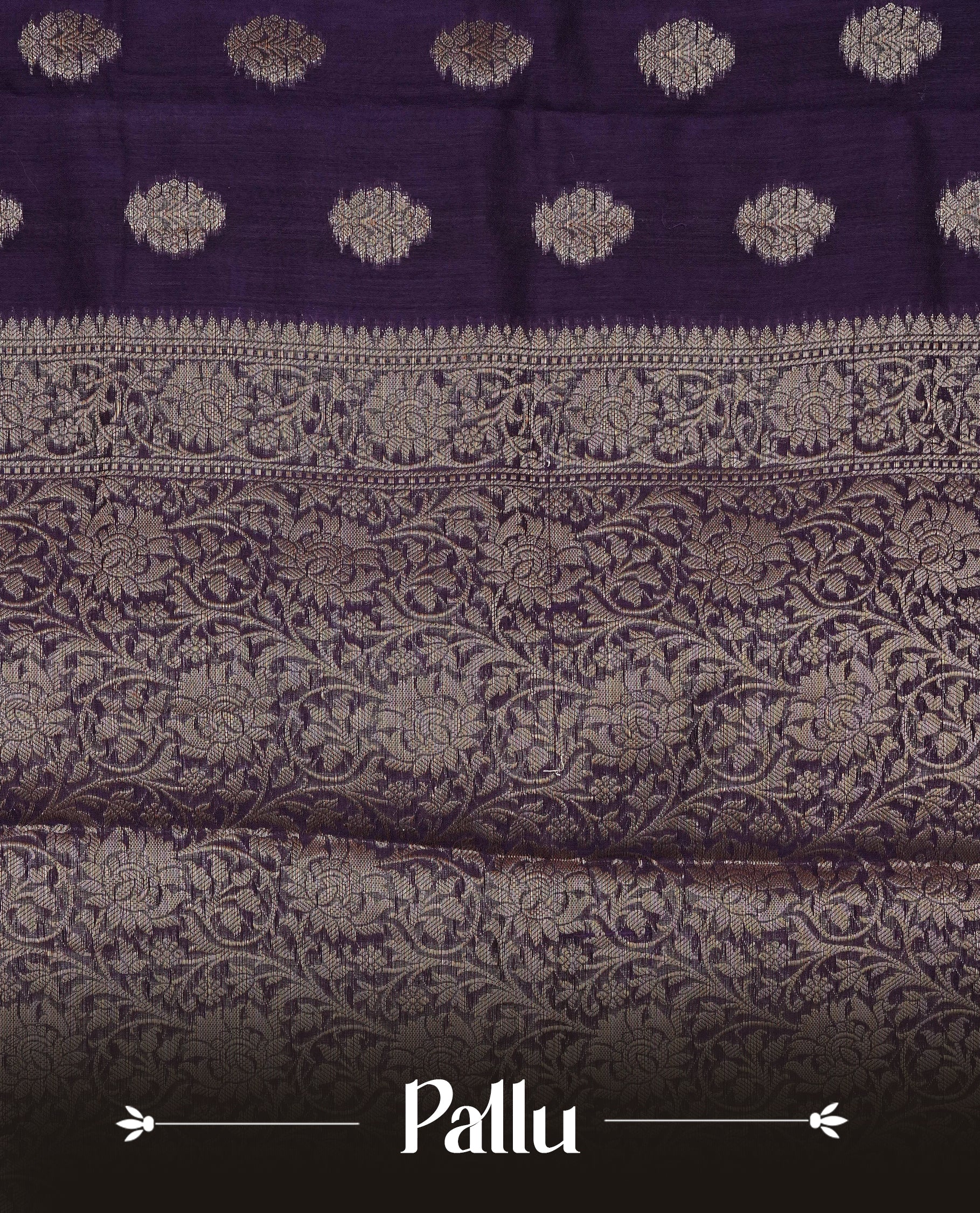 Royal Purple colour Tussar Silk saree featuring antique zari butta motifs on the body, enhanced with a self-coloured floral zari border and pallu, paired with a matching blouse piece.