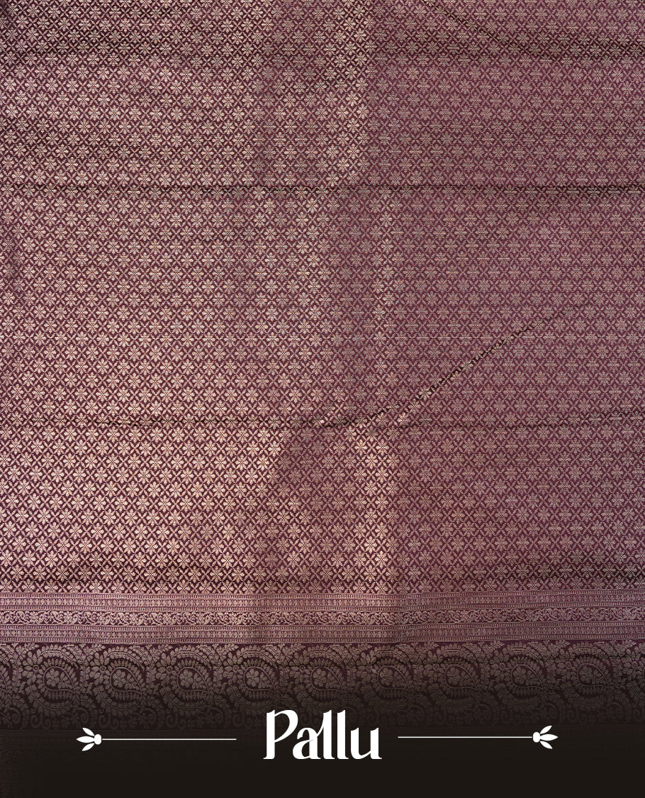Cream colour semi wedding saree featuring gold zari floral kode pattern on body, complemented by contrast burgundy with traditional border, paired with matching blouse piece.