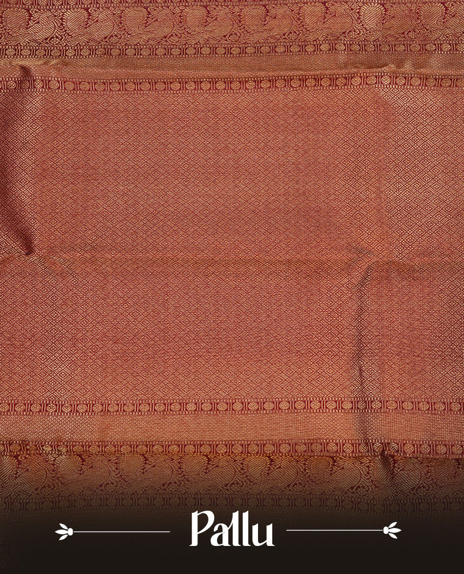 Maroon colour kancheepuram silk saree featuring gold zari floral kodi pattern on body, complemented by self colour with traditional border, paired with matching blouse piece.
