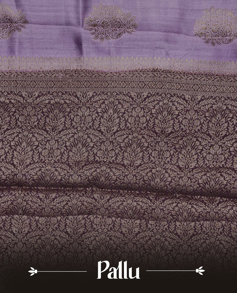 Lavender Colour Tussar Silk saree with elegant antique zari floral motifs On Body, a contrasting Wine zari border, a rich zari pallu, Paired With a matching blouse piece.