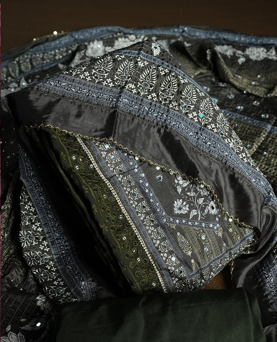 Dark Green colour churidhar material featuring Mirror and thread embroidery, foral print pattern on the self colour front panel, floral digital printed dupatta with elegant border, and matching plain bottom