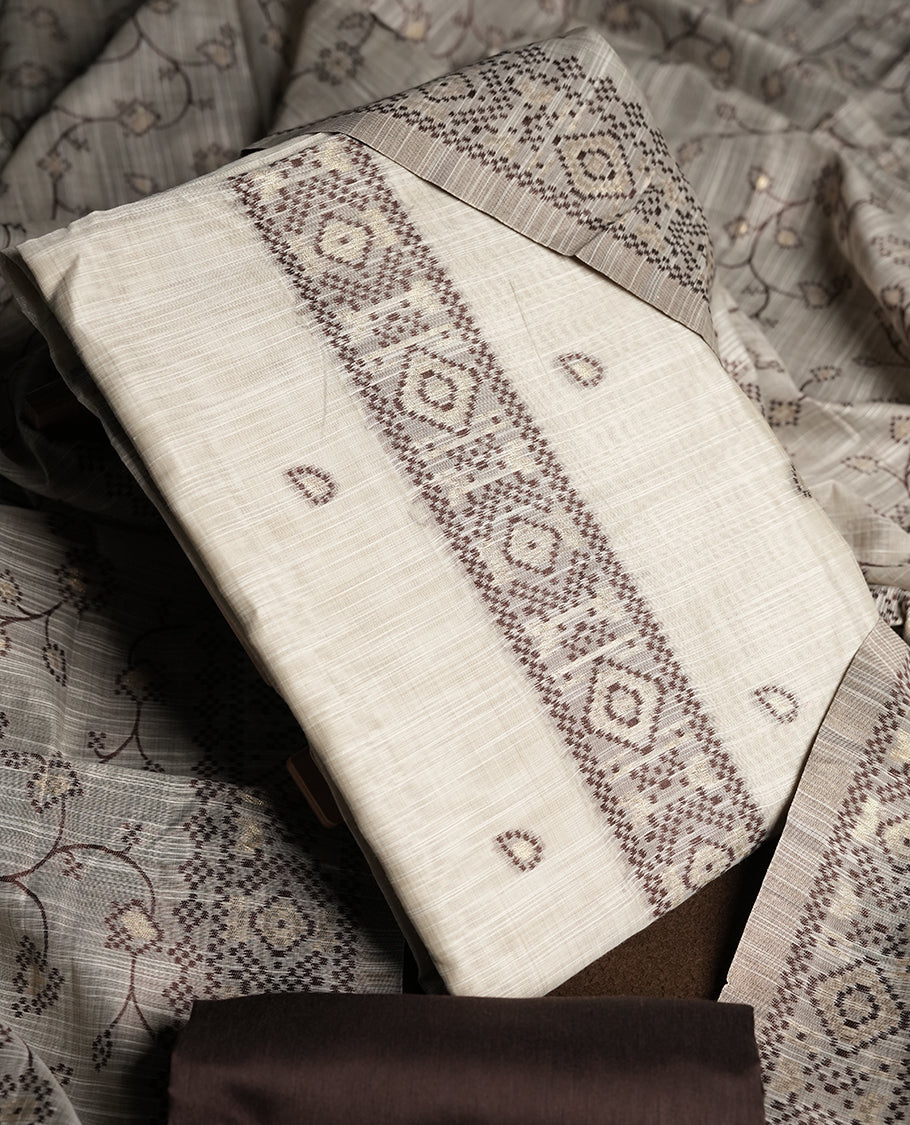 Cream colour churidhar material featuring Brown colour thread embroidery on the front panel, floral thread pattern dupatta with elegant border, and matching plain bottom.