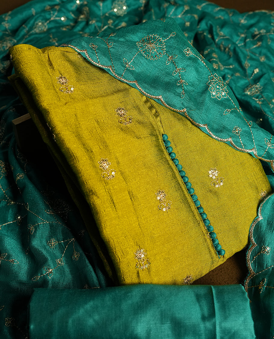 Olive colour churidhar material featuring thread embroidery on the front panel, contrast Green colour dupatta with elegant border, and matching plain bottom