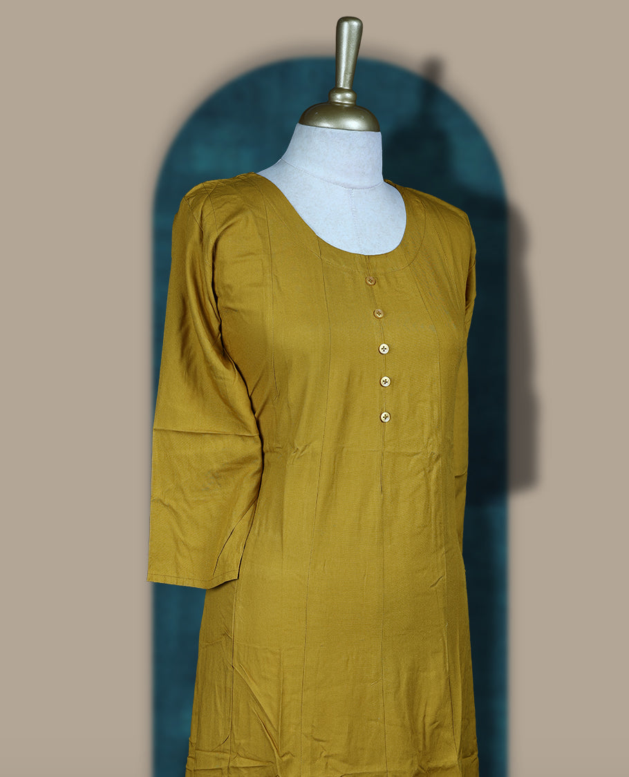 Mustard yellow colour cotton kurthi with front buttons and 3/4th sleeves & Features a round neck and minimalist design for a classy everyday look, Ideal for work or casual wear with maximum comfort.