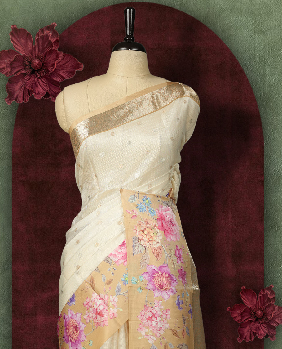Ivory colour Kotta Tussar Silk saree features a vibrant digital floral print with small gold zari motifs on the body, and elegant banarasi border adds a regal touch & Paired with a matching blouse,blending modern design with traditional elegance.