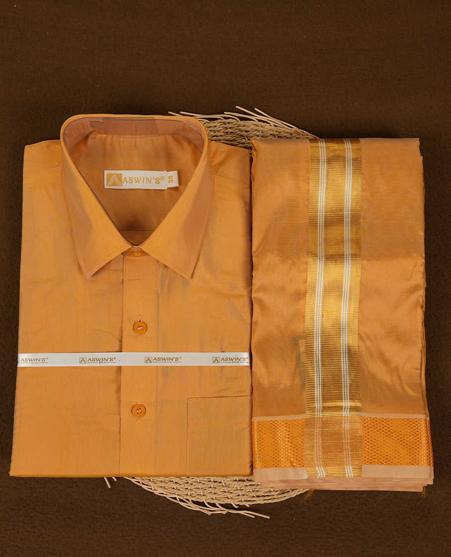 Gold colour Aswin’s wedding set featuring a refined silk shirt and matching dhoti with gold zari detailing, crafted for timeless elegance and perfect for traditional weddings and festive occasions.