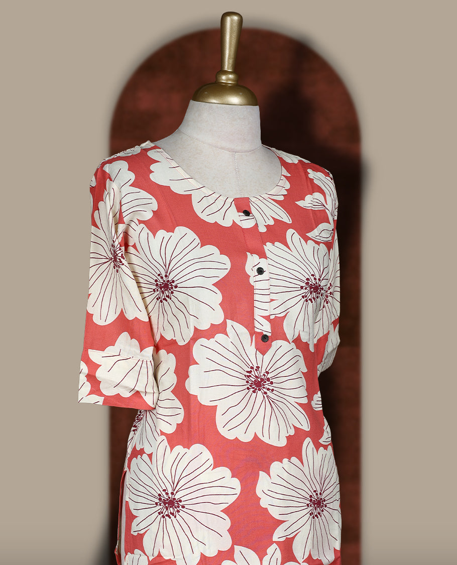 Soft Peach colour coord set adorned with all over off white colour floral prints, featuring a straight cut kurta with round neckline and 3/4th sleeves, paired with matching bottoms.