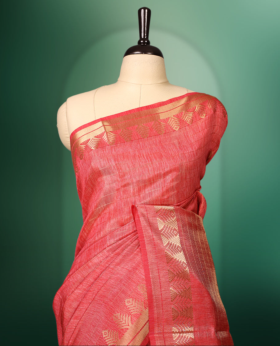 Peach Pink colour saree featuring subtle golden woven motifs on the body, complemented with a rich golden zari border and pallu, and paired with a matching blouse