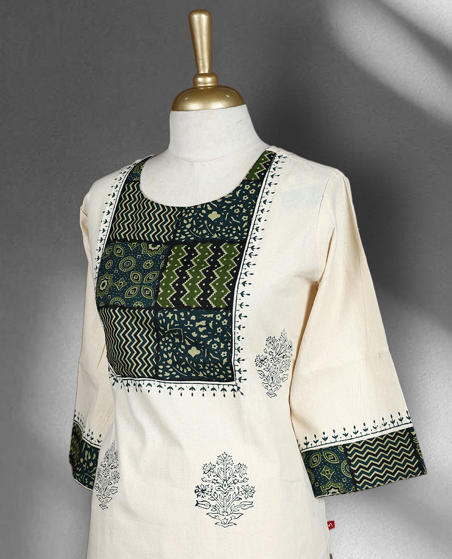 Off white colour cord set with delicate grey motifs, featuring a round neck top with patchwork detail in green and black, and matching embroidered straight fit pants.