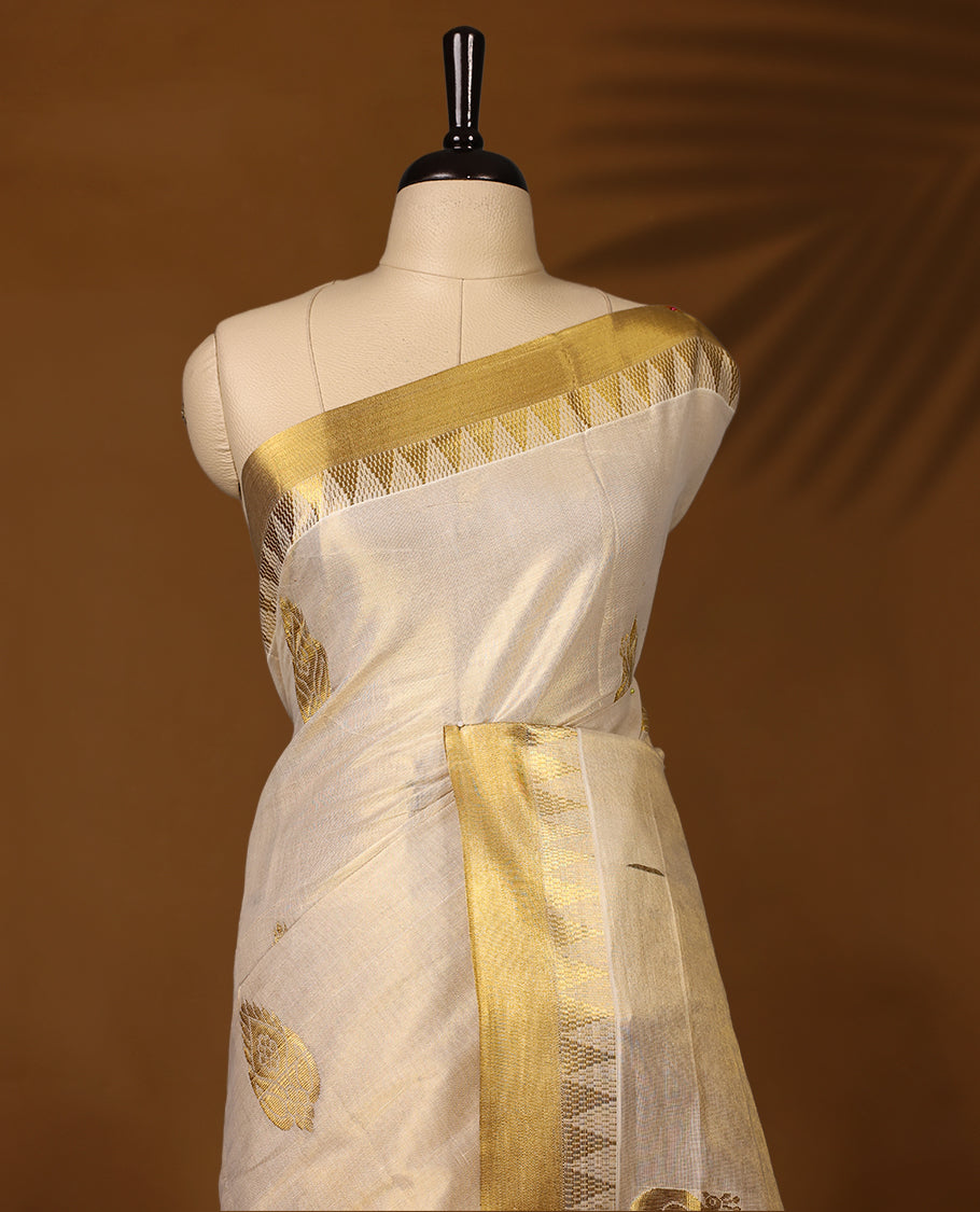 Elegant Kerala Kasavu saree in ivory with golden zari work. Perfect for festivals, weddings, and traditional events, Pair with a contrast blouse and gold jewelry for a timeless, graceful look.
