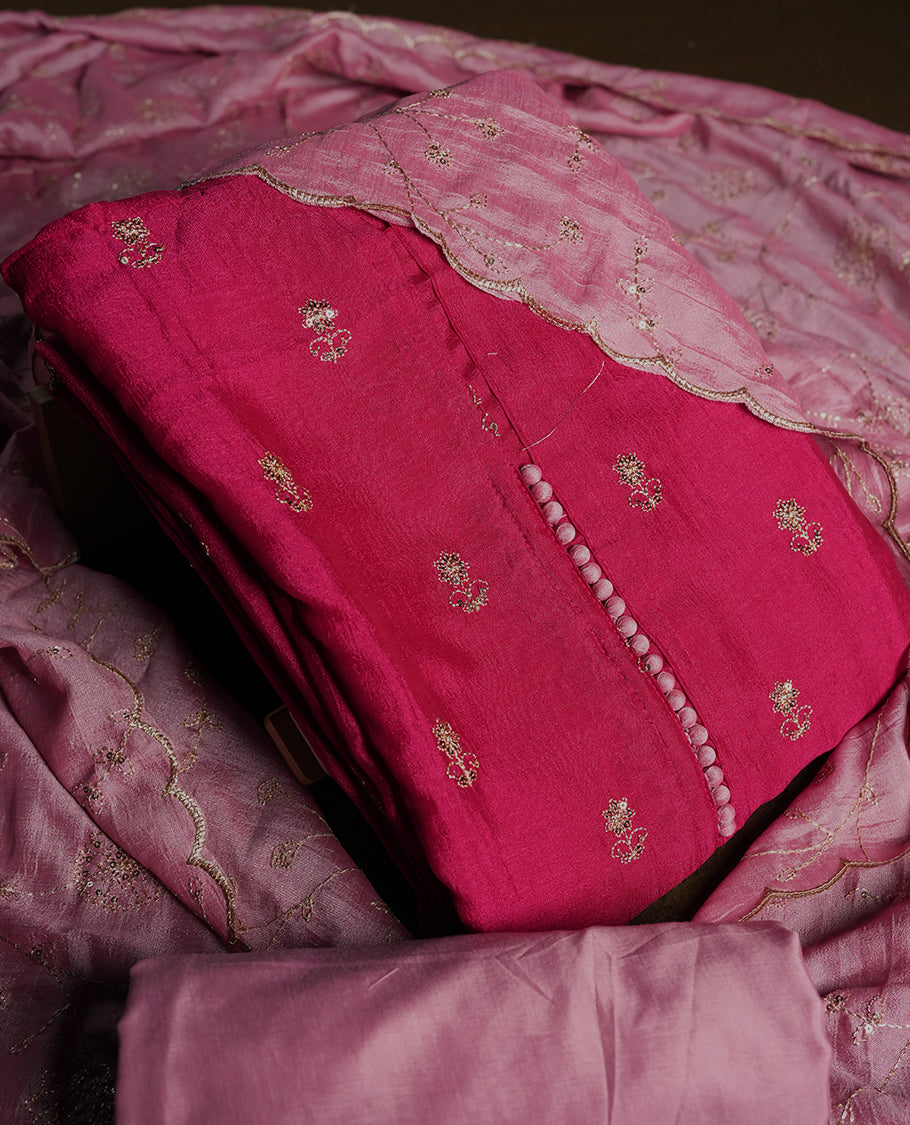 Dark pink colour churidhar material featuring thread embroidery on the front panel, contrast Light pink dupatta with elegant border, and matching plain bottom