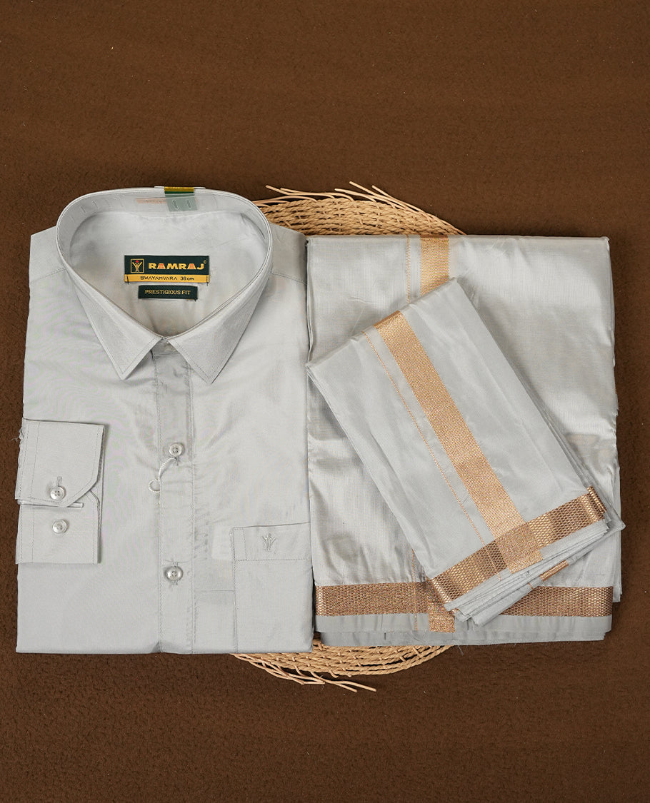 RAMRAJ Silver Grey Colour kurtha paired with a Silver Grey dhoti and a Silver Grey towel, elegantly finished with a matching Gold border.